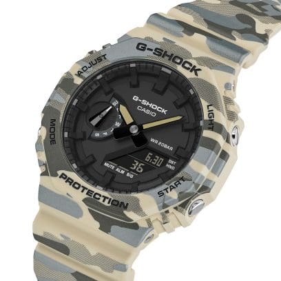 A slightly angled view of the GA-2100CM-5AER in camouflage pattern. Some grey patches have a subtle shimmer, while others feature a fine dotted design.