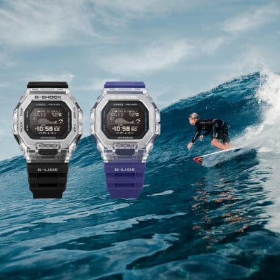 The two color variants black and purple of the GBX-100S against a background with a surfer in the sea