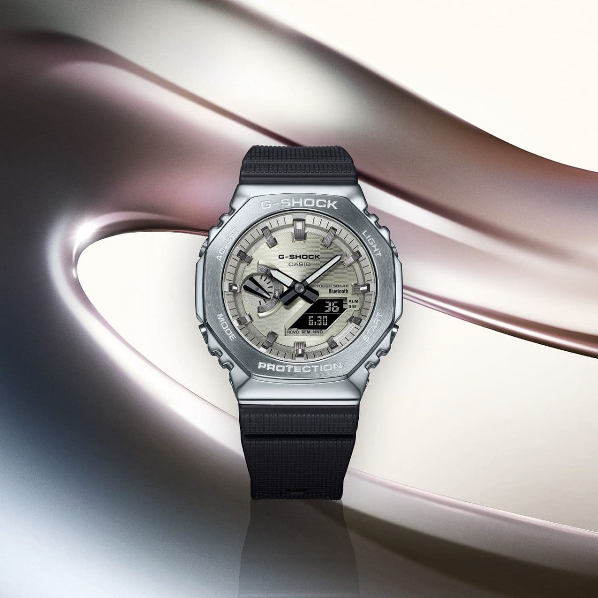 The GBM-2100A-8BER against a background of round shapes in various shades of grey