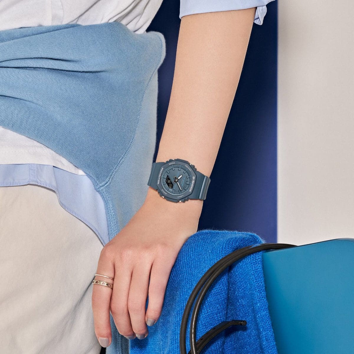 A woman is wearing the GMA-P2100BA-2AER on her wrist.