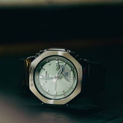 Close-up of the GM-S2110-3A on a dark, slightly reflective surface against a dark background.