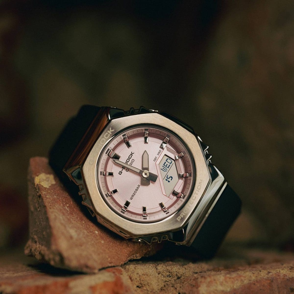 Close-up of the GM-S2110-4AER. The watch is leaning against a brick. 