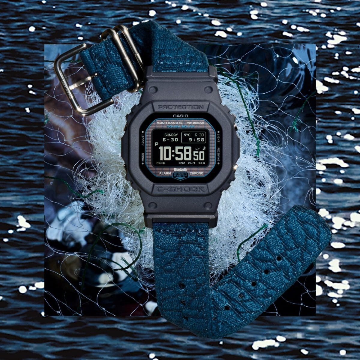 The GW-BX5600CBG-2ER wristwatch against a background showing various fishing nets.
