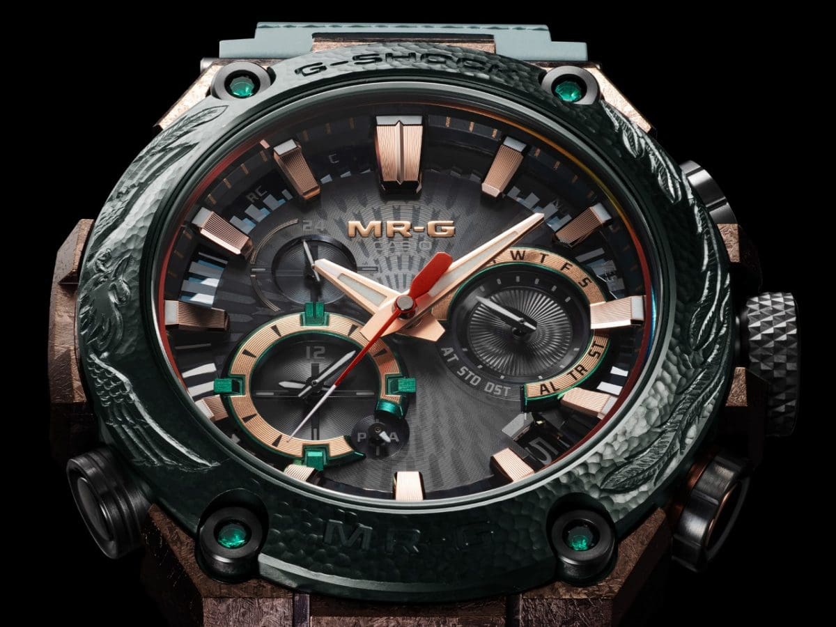 Close-up of the analog dial of the MRG-B2000KT-3ADR with copper-colored hands and indices.