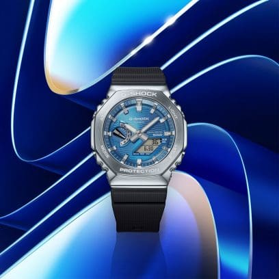 Vooraanzicht van de GBM-2100A-2BER tegen een achtergrond van ronde vormen in verschillende tinten blauw