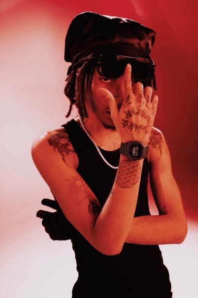 Man wearing a DW-5600UBB-1 pointing to sunglasses