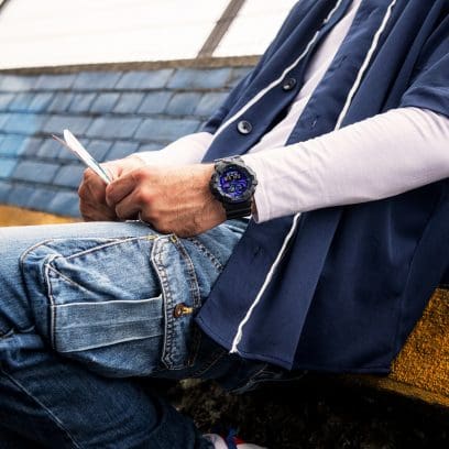 G-SHOCK Black Analog Digital GA700-1B Watch with Blue Dial on wrist in relaxed pose denoting style