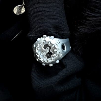 G-SHOCK GAV01A-8A silver watch against a black backdrop denoting style