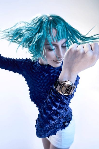 Woman with a GM-6900CMG-3 in an expressive pose
