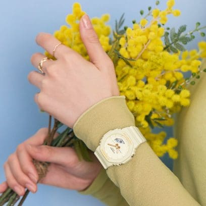 GMA-P2100W-7A G- SHOCK on a smaller  wrist with beautiful yellow flowers