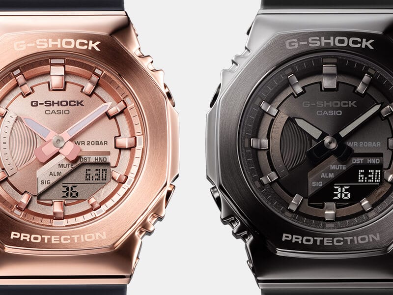 Eine roségoldene Casio G-Shock GM-B2100 neben der schwarzen GM-B2100BD-1A