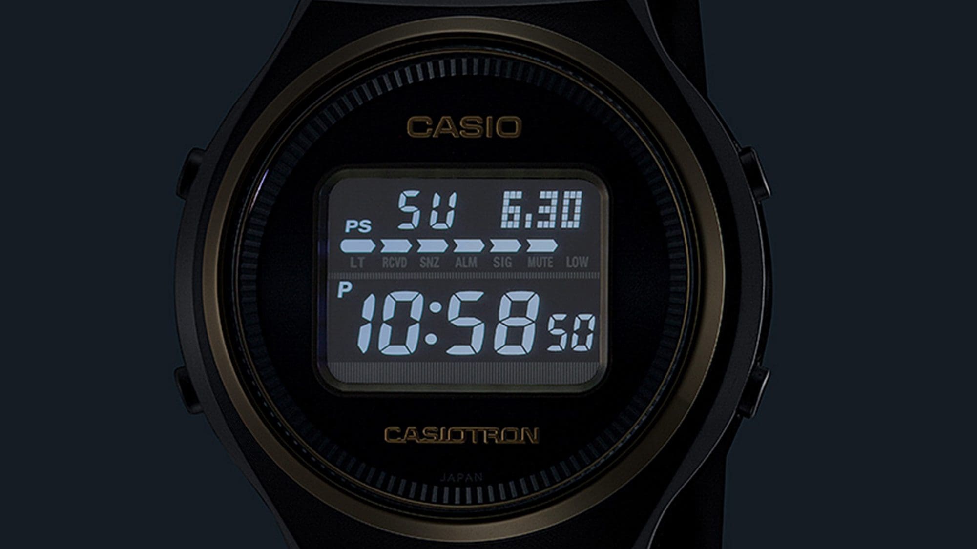 The illuminated display of the TRN-50ZE-1A digital watch in the dark
