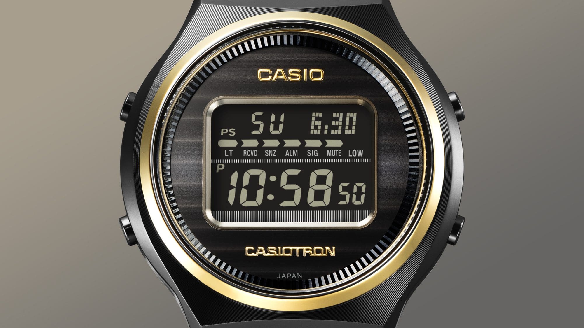 Close-up view of the display and bezel of the black Casiotron TRN-50ZE-1A digital watch with gold-coloured details