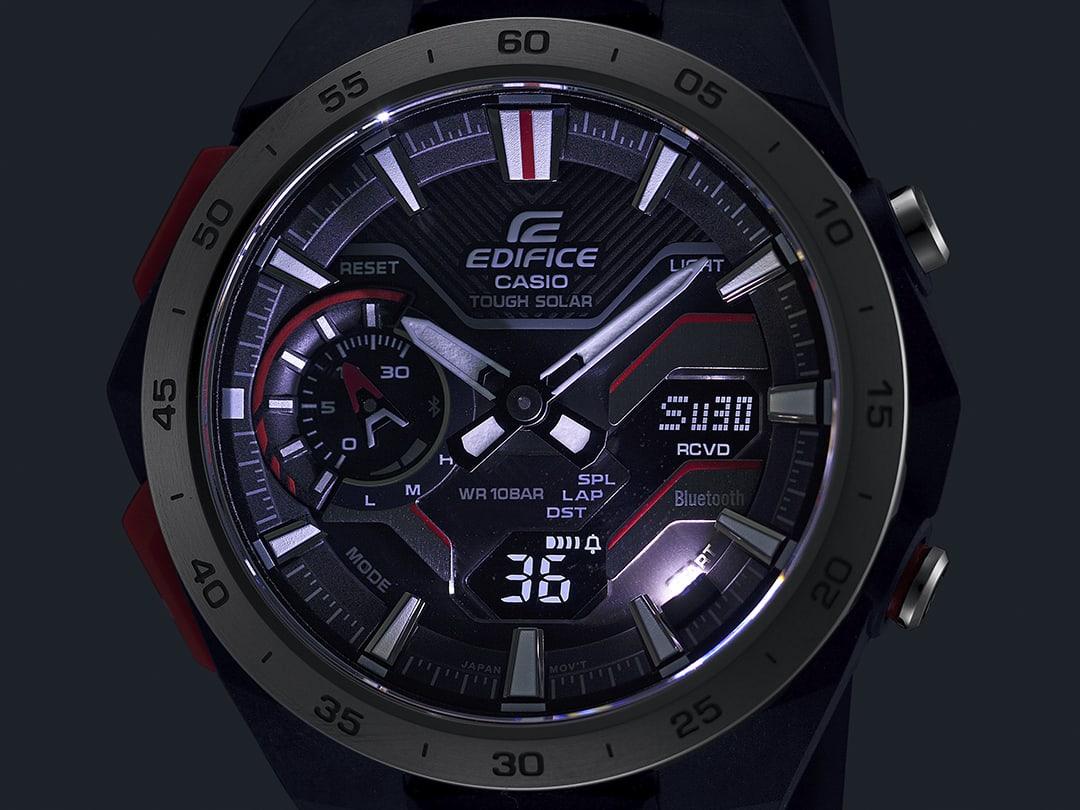 Close-up of the dial of an ECB-2200 model in the dark with dual LED illumination