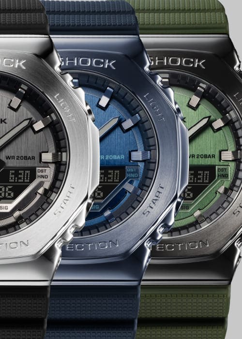 The three colour variants of the Casio G-Shock GM-2100 model: silver, blue and green