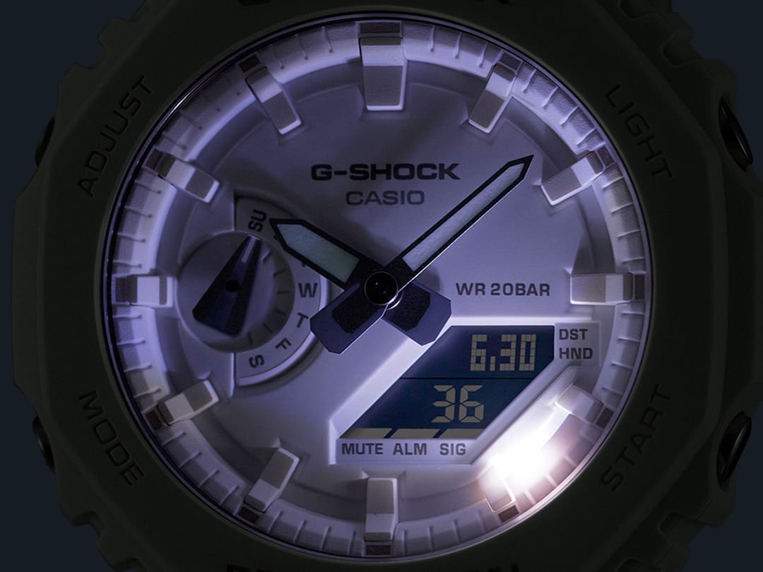 The illuminated display of the digital-analogue GA-2100-7A7 wristwatch in the dark