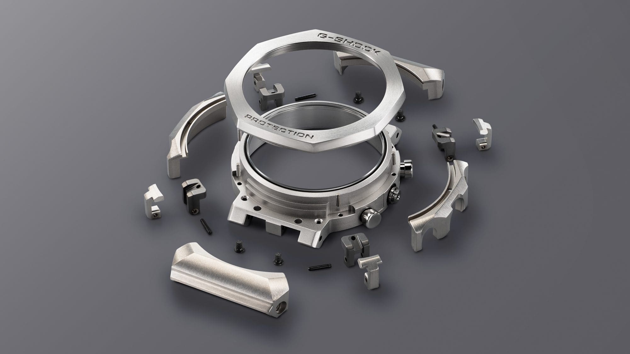 Individual components of the full metal case of an MRG-B2100D wristwatch with Multi-Guard structure