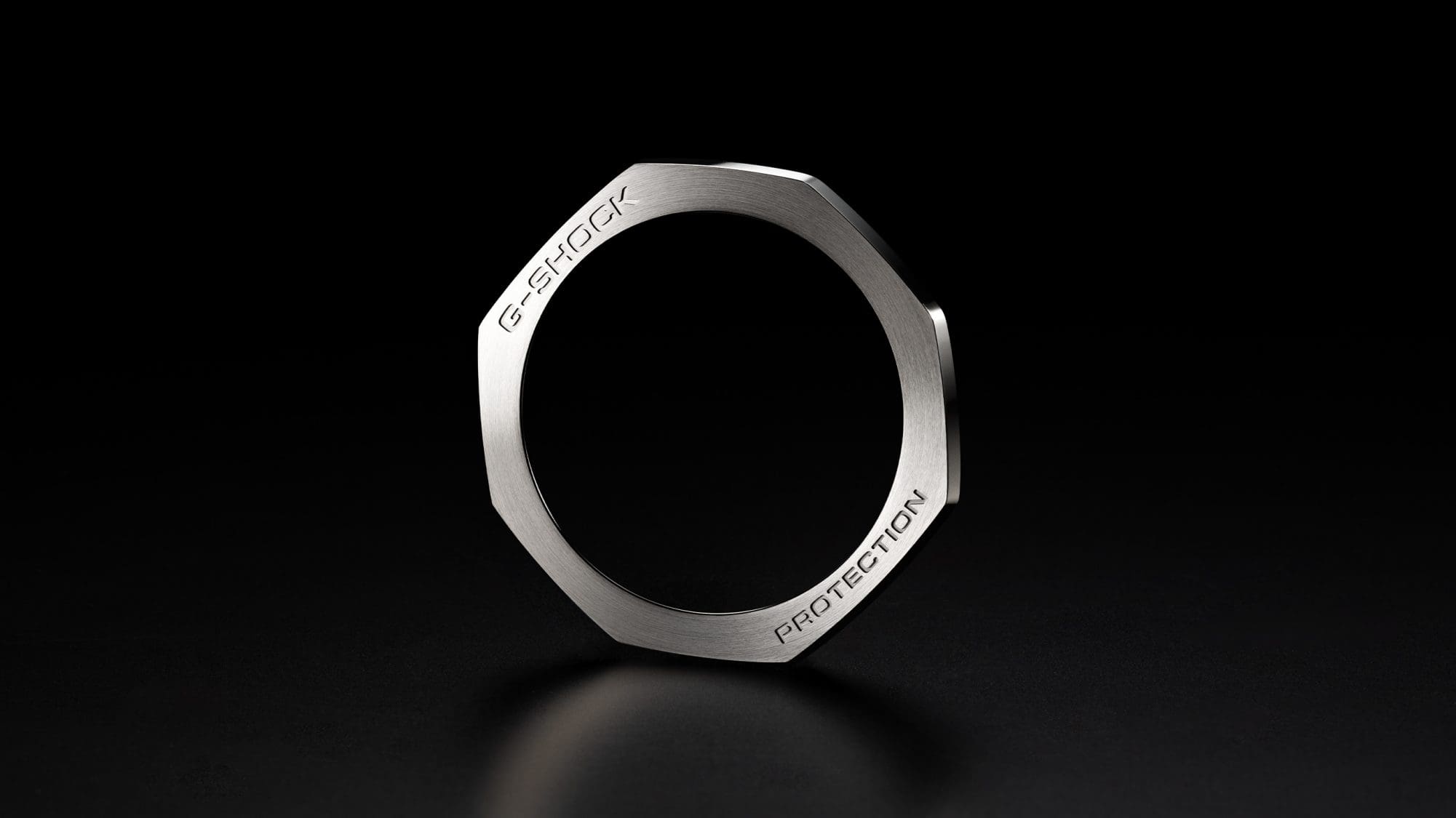 Silver-coloured bezel against a black background