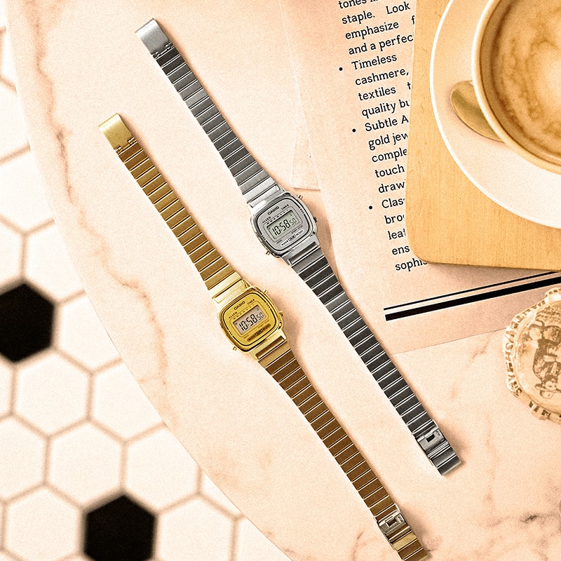 Photos of gold and silver watches on a table.