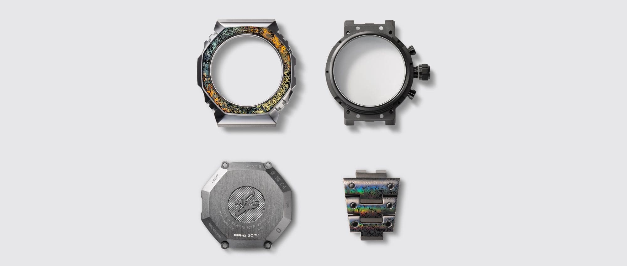 A photo of the MRG-B2100HR-1A, the top bezel made with “Coballion”, “DAT55G” on the bracelet, and “64 Titanium” on the case, case back, buttons, and crown