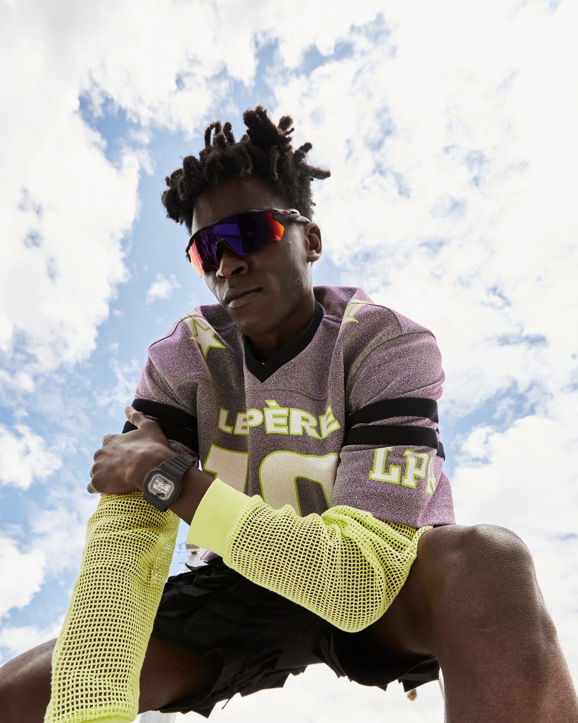 Man, dressed in sports-inspire streetwear, wearing black DWH5600-1 health & wellness oriented Heart Rate Monitor