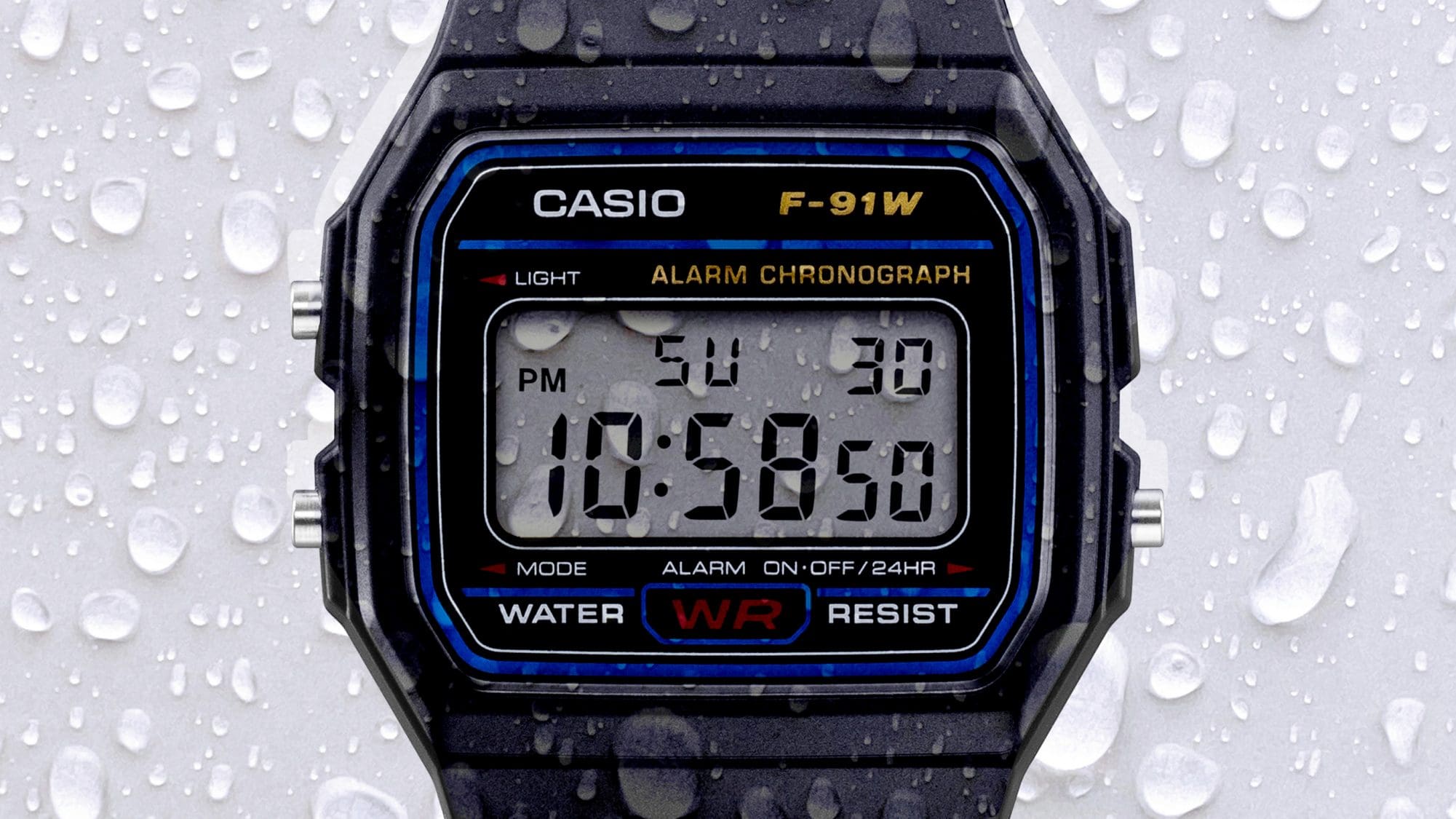 Pantalla del F-91W con gotas de lluvia para demostrar su resistencia al agua