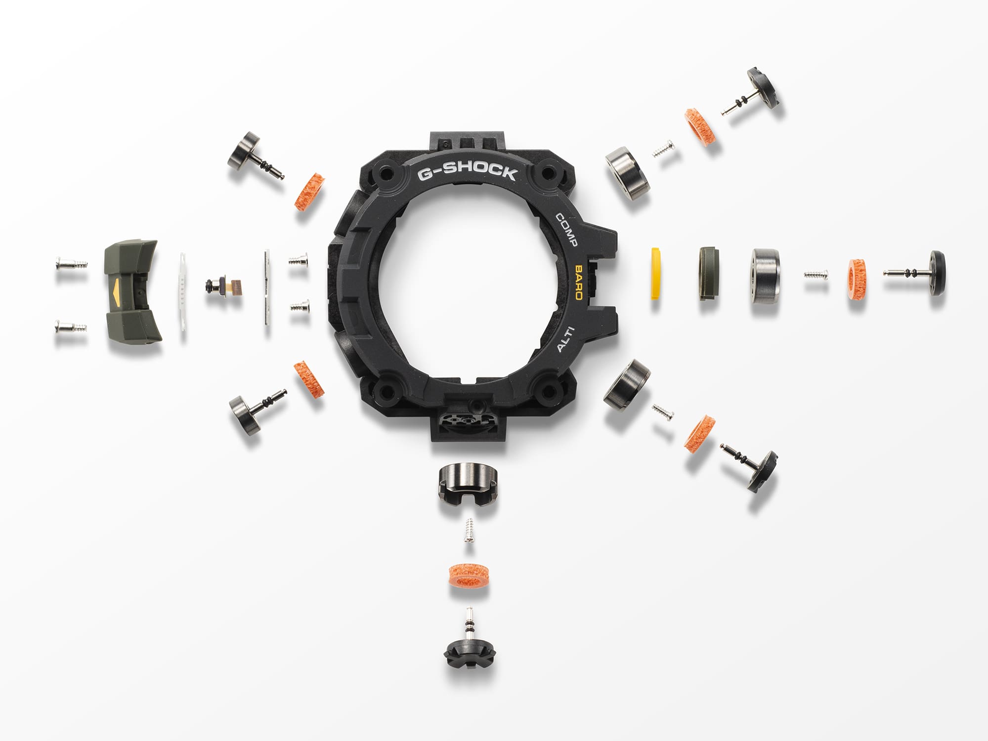 El bisel negro de un reloj de pulsera GW-9500, rodeado de sus componentes individuales como botones, tornillos y juntas