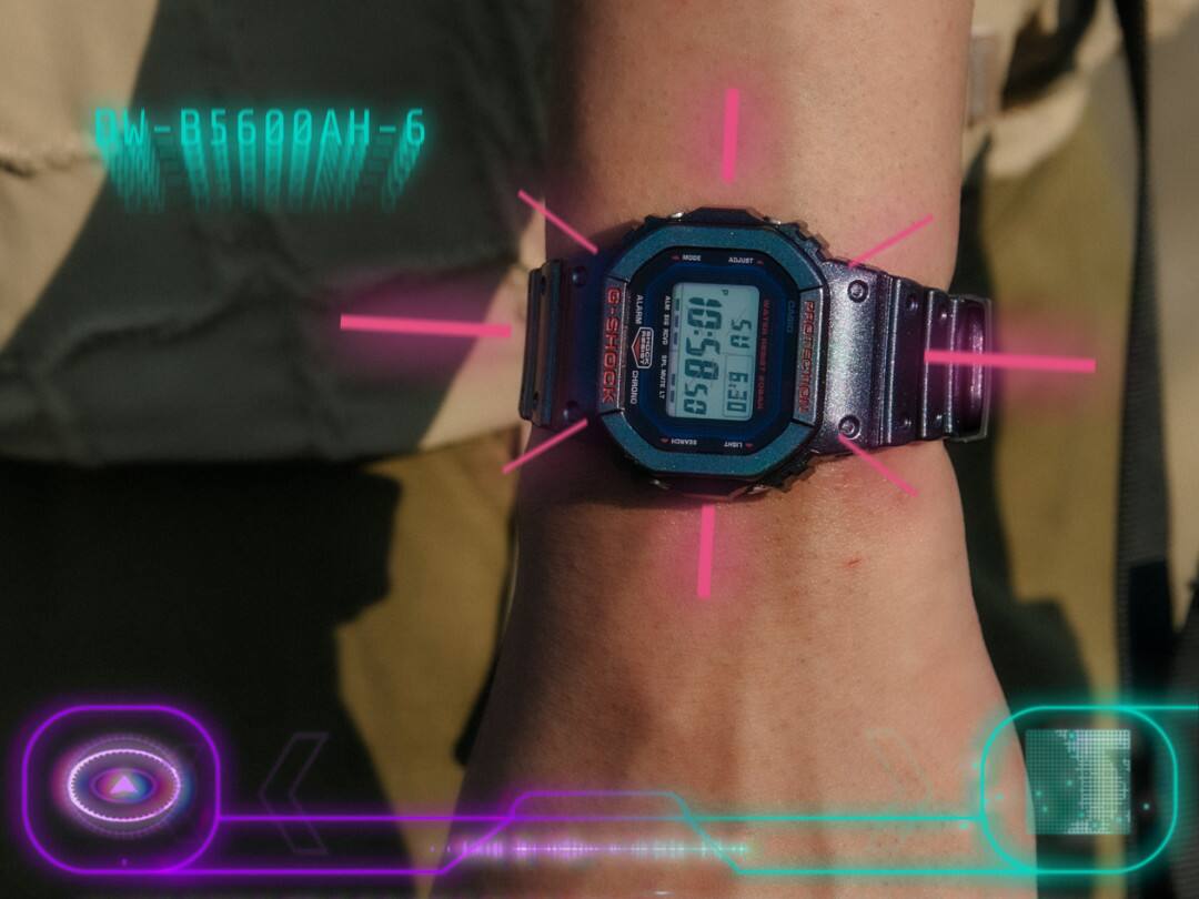 La montre Bluetooth® DW-B5600AH-6 au poignet, entourée de graphiques fluo qui font référence à des mondes virtuels