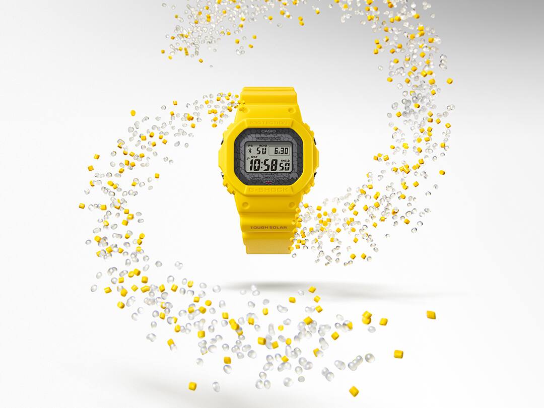 GW-B5600CD-9 La montre numérique Casio G-Shock GW-B5600CD-9 jaune entourée de tourbillons de résine transparente et jaune