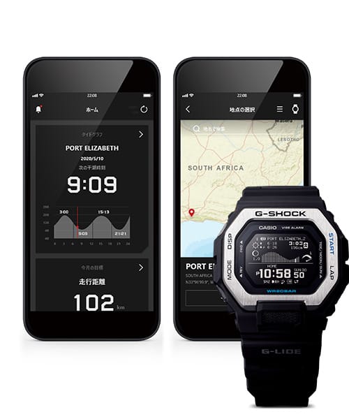 Devant : une montre de surf Casio GBX-100 avec un bracelet noir et une lunette en acier inoxydable argentée, derrière : Deux smartphones affichent dans l'application G-Shock Move des informations différentes sur le spot de surf de Port Elizabeth en Afrique du Sud.