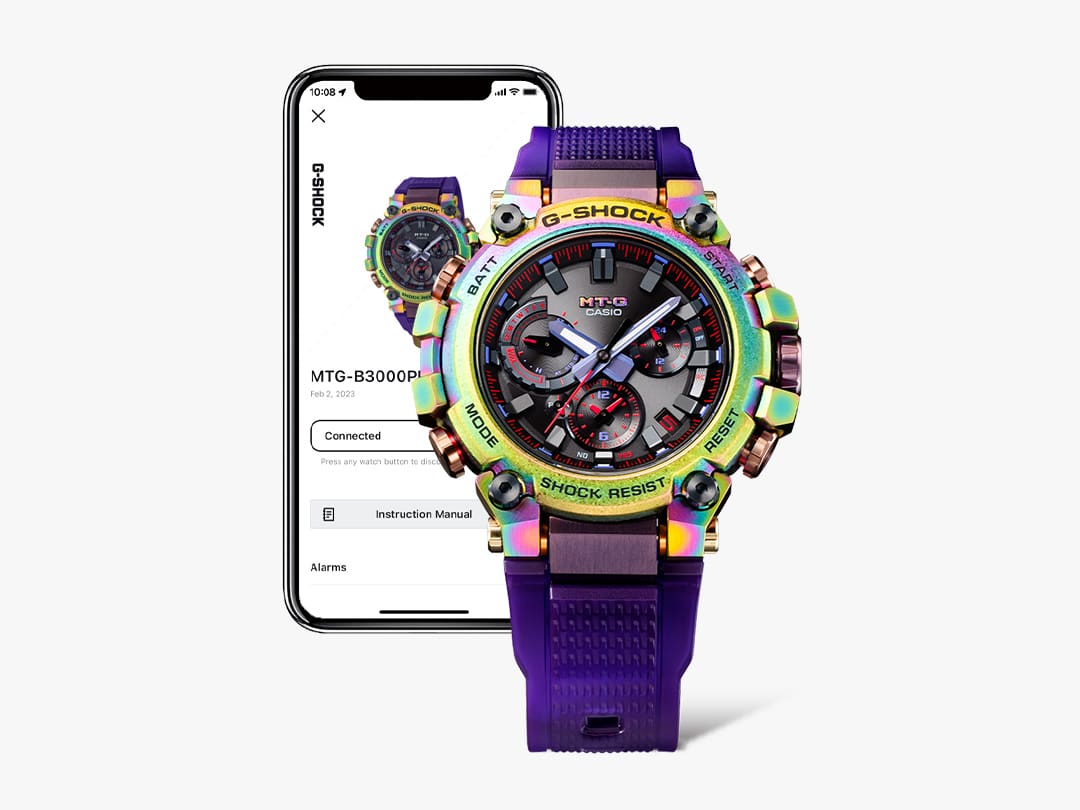 La montre MTG-B3000 à côté d'un smartphone sur lequel l'application CASIO Watches est ouverte.