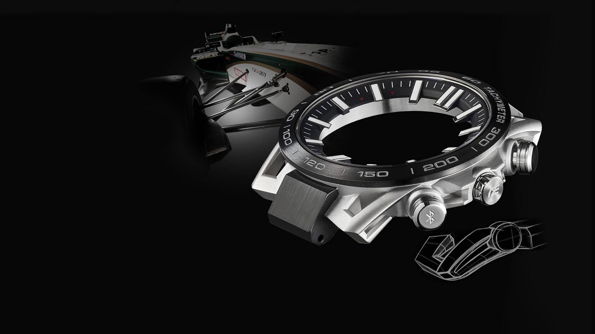 Primo piano della cassa di un orologio da polso Casio Edifice EQB-2000, sullo sfondo si vedono le sospensioni di un'auto da corsa