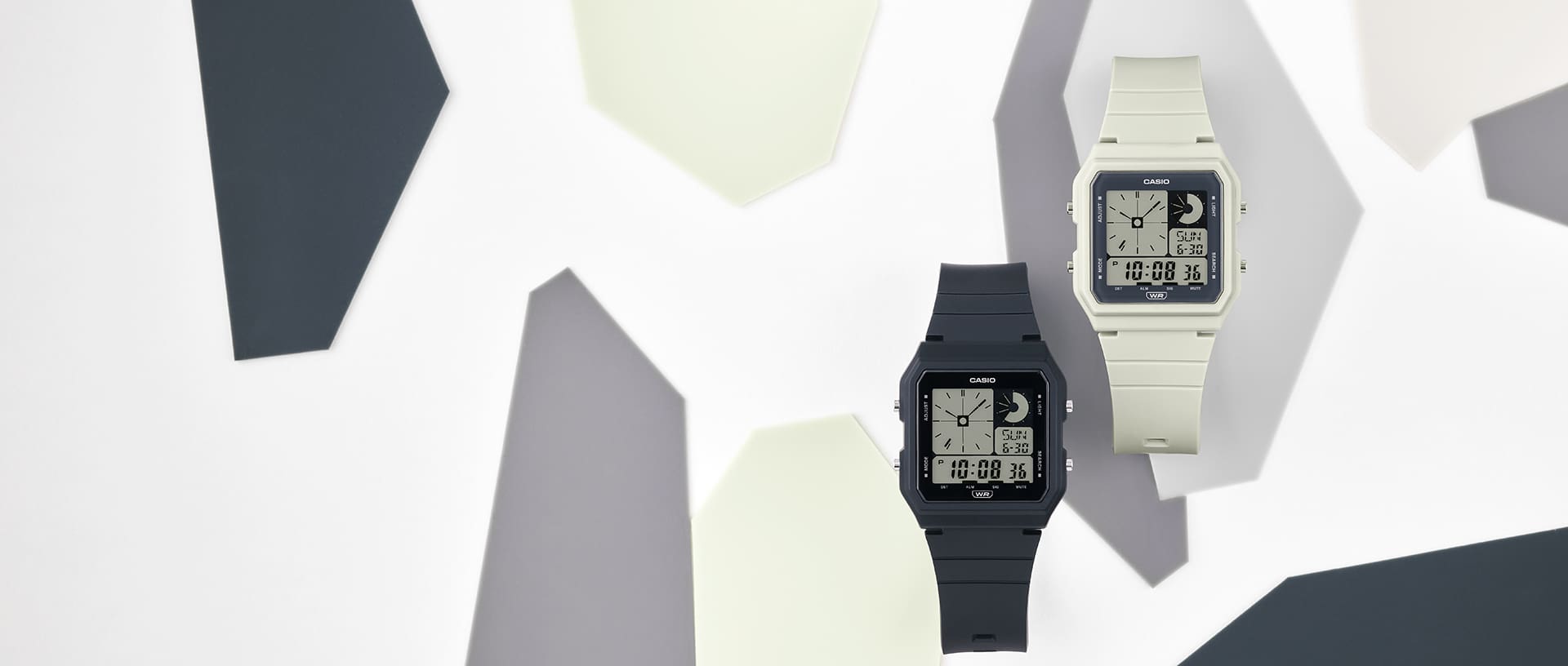 Het donkerkleurige LF-20W-1A polshorloge en het lichtkleurige LF-20W-8A polshorloge van Casio met een vierkante wijzerplaat en verschillende digitale d