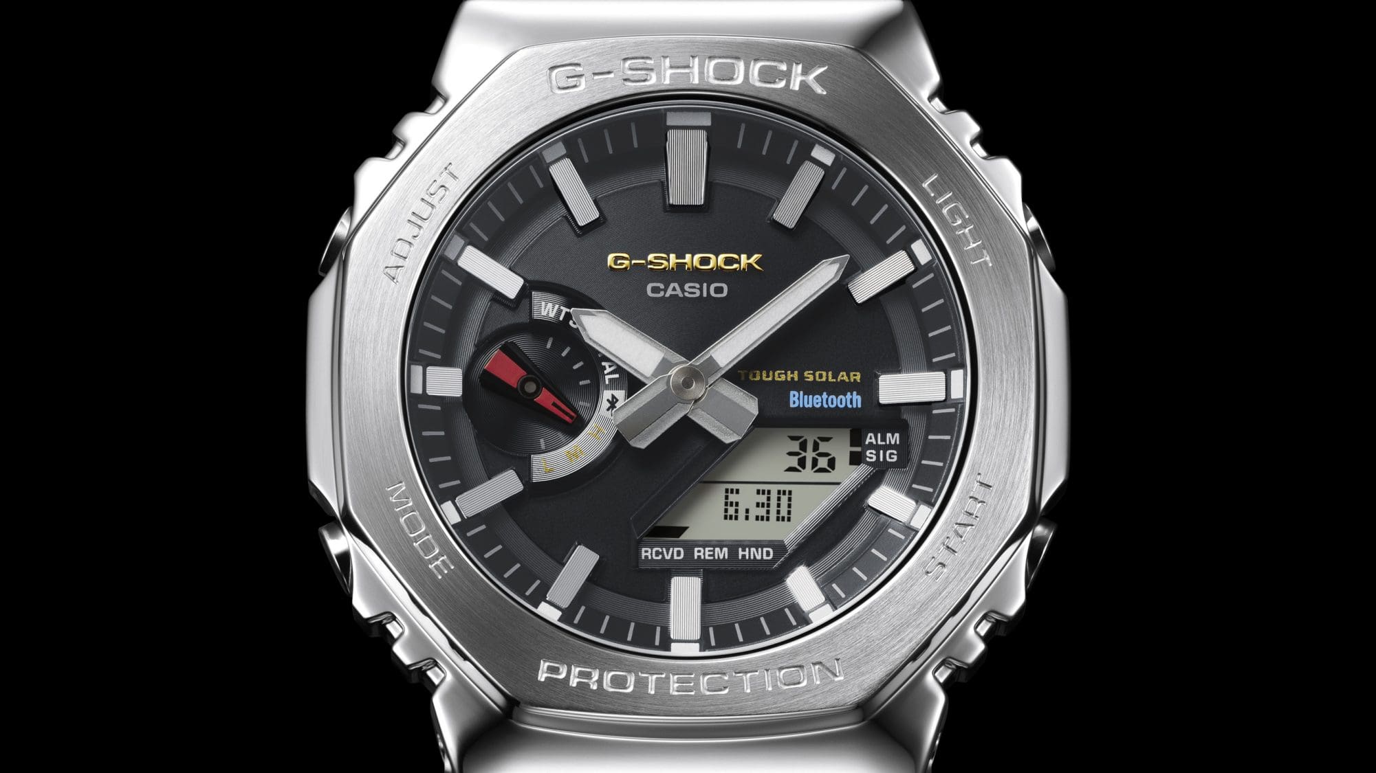 Relógio analógico com moldura octogonal que apresenta as cores simbólicas do G-SHOCK GM-B2100SD original