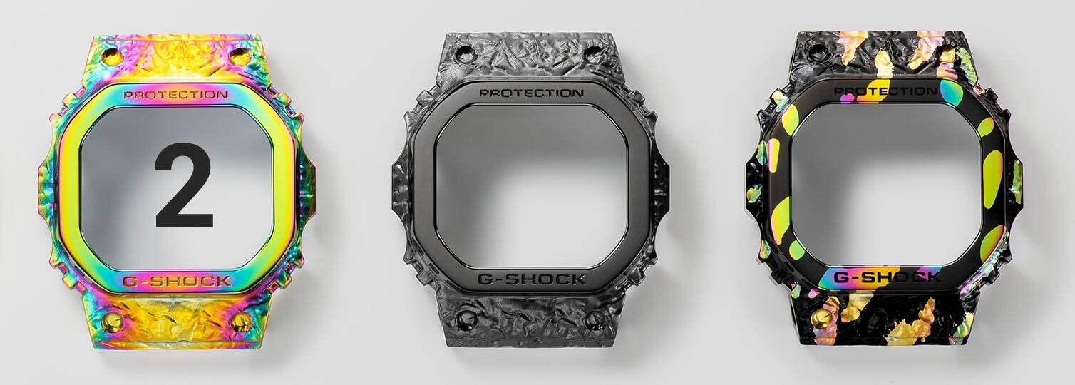  A luneta de aço inoxidável do GM-5640GEM-1 em três etapas de acabamento adicionais: 1. com revestimento de iões coloridos, 2. com revestimento de iões pretos sobre o primeiro revestimento parcialmente coberto e 3. a luneta multicolorida acabada