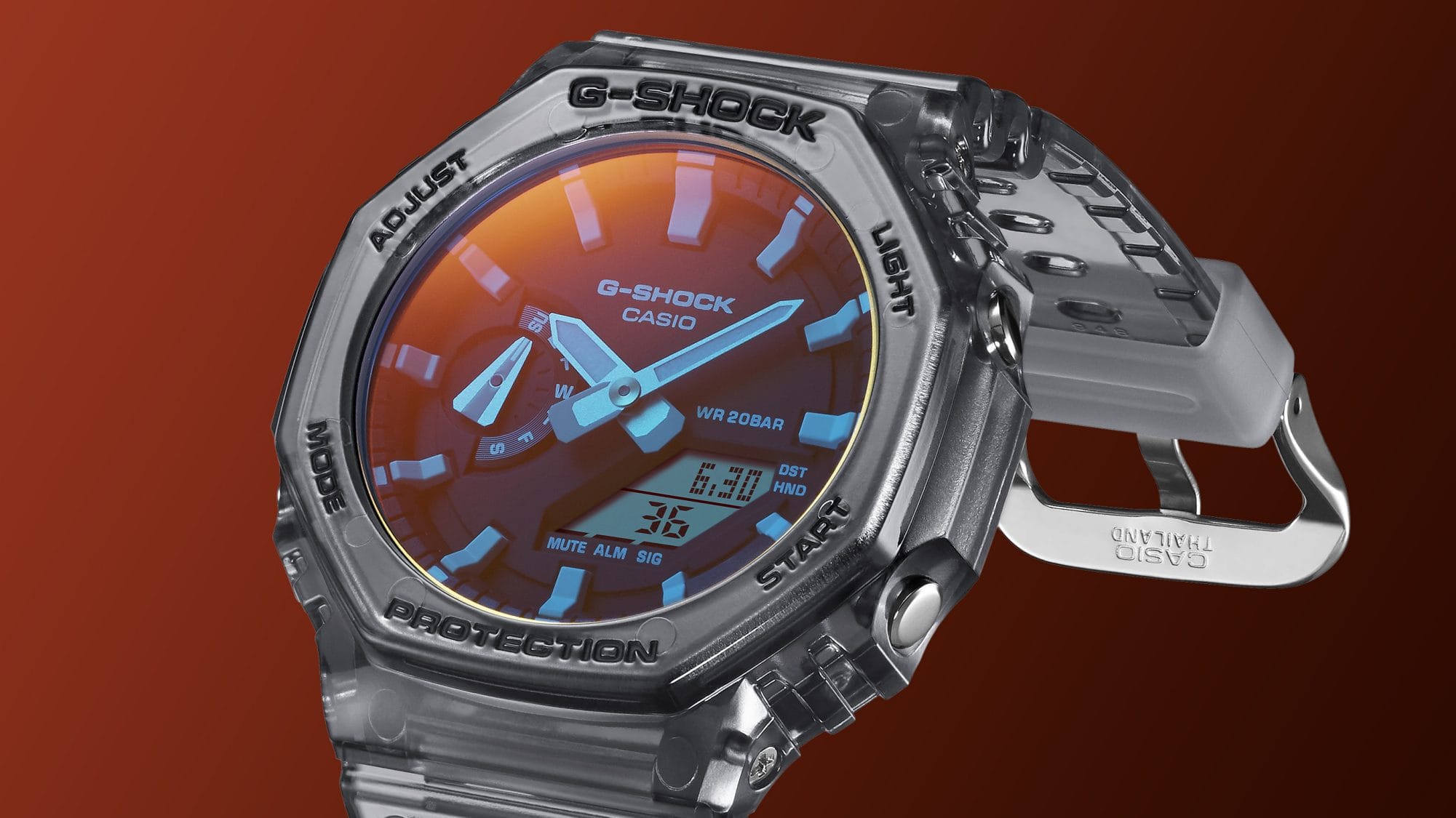 GA-2100TLS-8A Vista diagonal do relógio de pulso digital-analógico GA-2100TLS-8A com bracelete cinzenta e mostrador em tons de laranja e azul